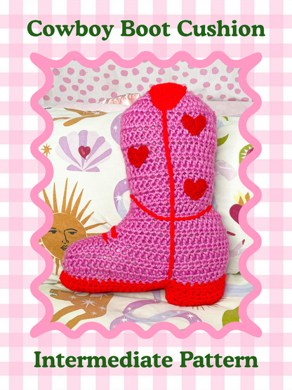Pattern cover of a crochet pillow shaped like a cowboy boot in pink with red detailing and the text title 'cowboy boot cushion pillow' and skill level 'intermediate' on the front.