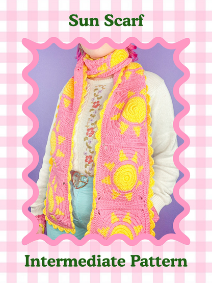 Pink and yellow sun-patterned scarf on a person
