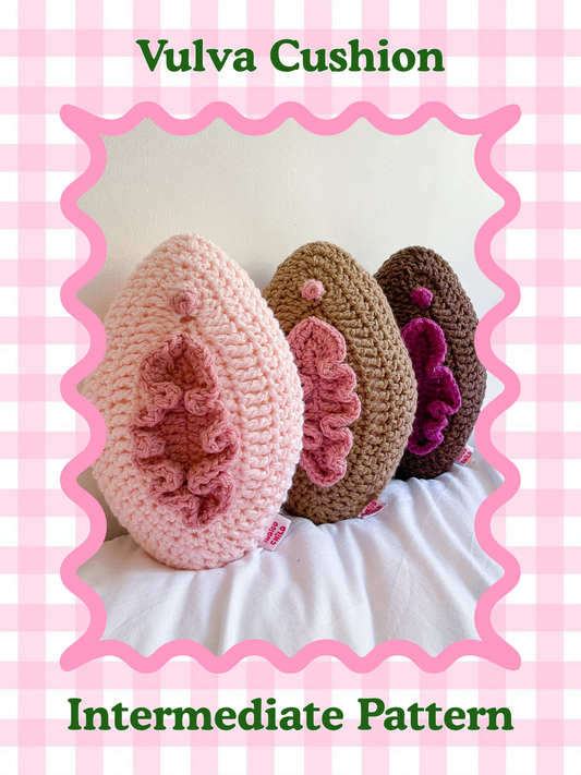 Crochet pattern cover of three pillows lined in a row in cream, light brown and dark brown all resembling vulvas with the title text 'vulva cushion pillow' and skill level 'intermediate'.